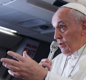 Pope Francis answers questions from journalists aboard his flight from Manila, Philippines, to Rome Jan. 19. (CNS/Paul Haring)